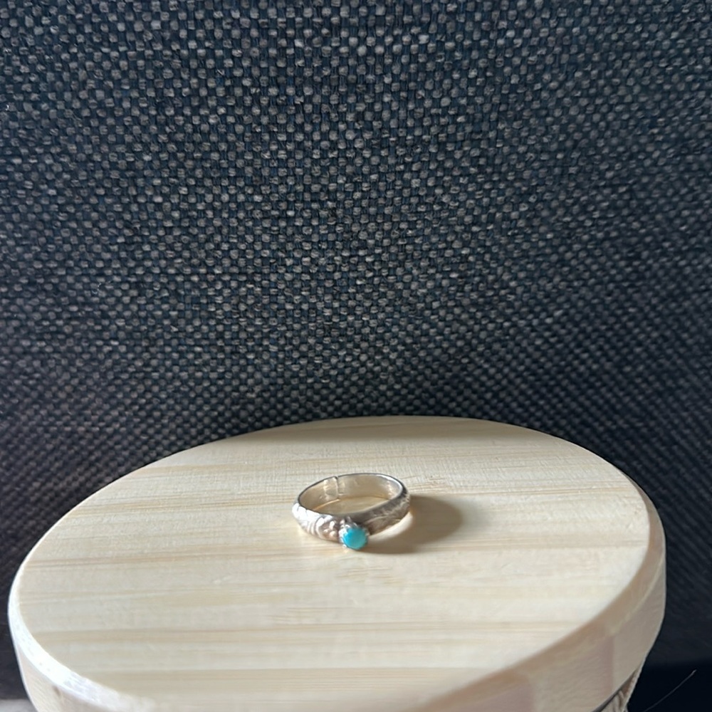 Small turquoise stone imprinted ring